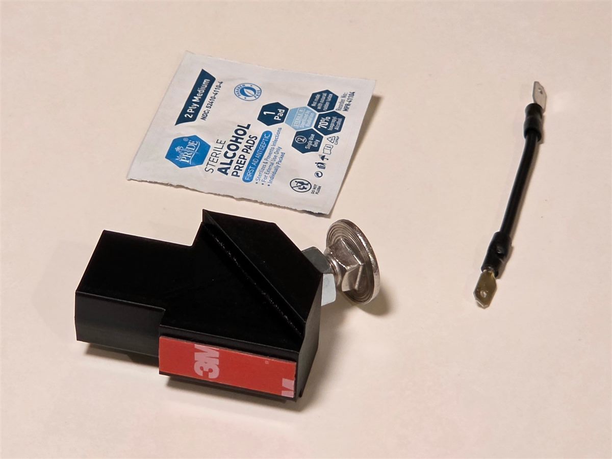 Kit contents: clutch stop with stainless adjustment bolt and 3M tape, alcohol prep pad, and clutch start bypass wire