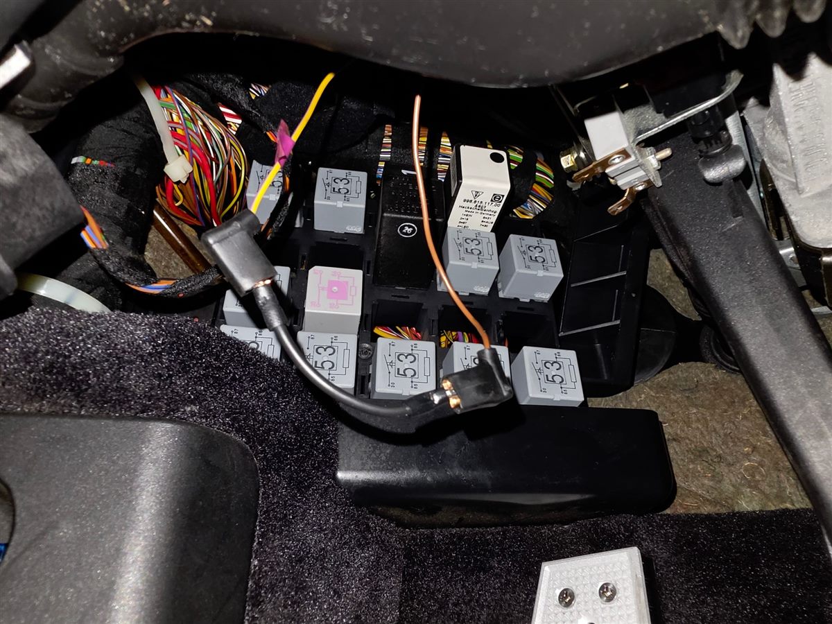The two factory spade connectors joined by the Renetic bypass wire under the dash