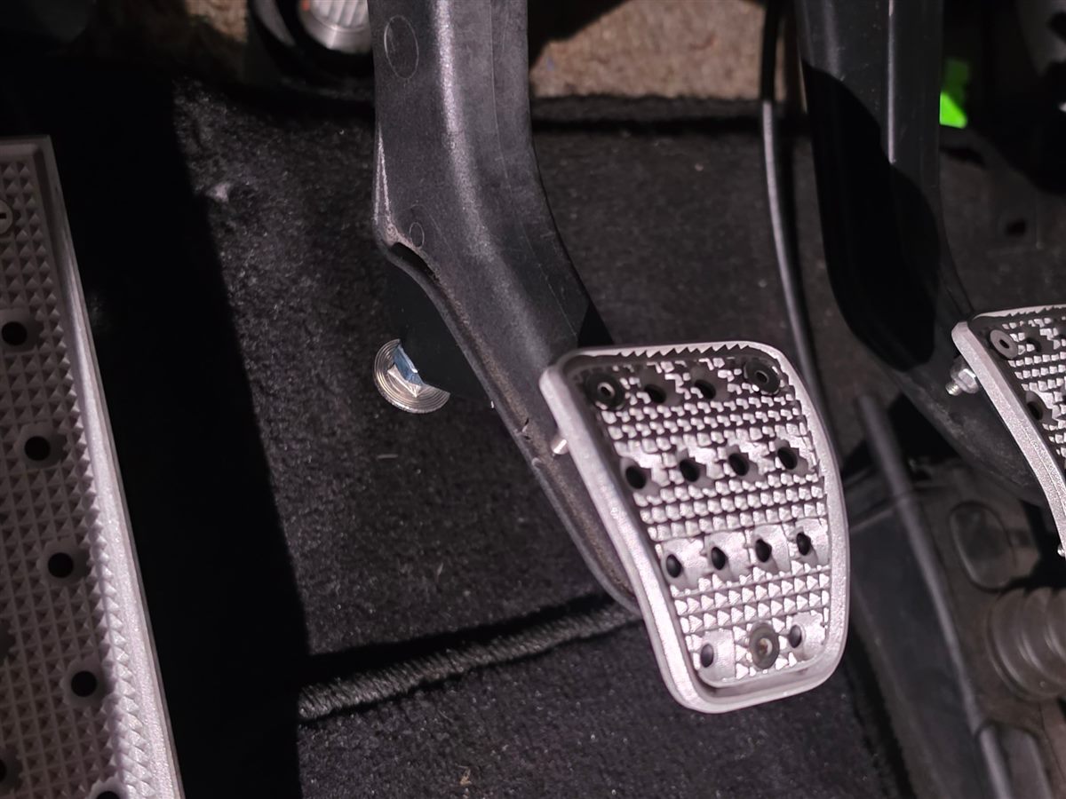 Renetic clutch stop installed behind the clutch pedal with the stainless bolt resting toward the floor